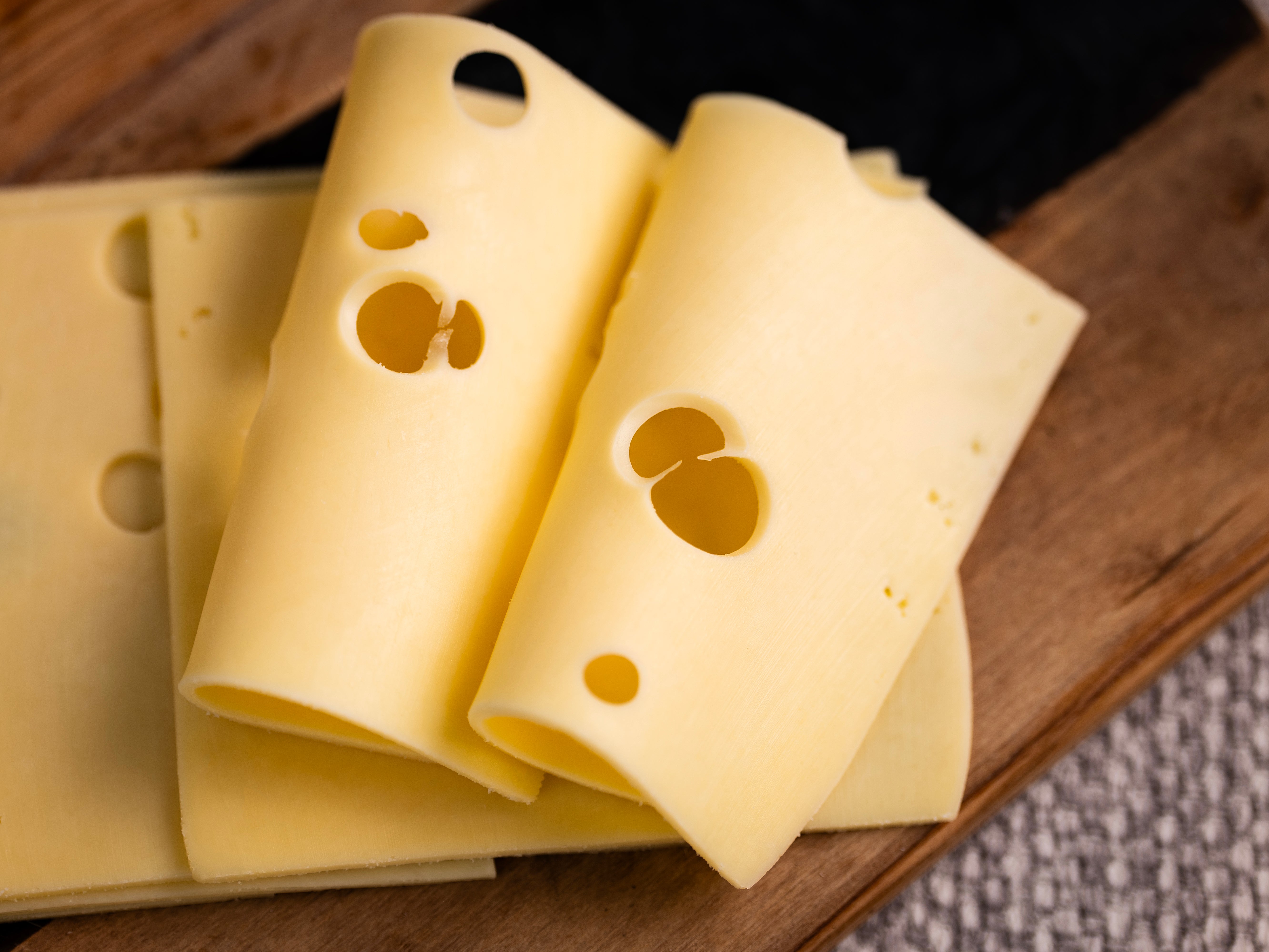 SLICED EMMENTAL CHEESE 1KG β Failte Foods
